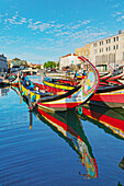 Moliceiro boats floating on Aveiro main canal, Aveiro, Portugal, Europe