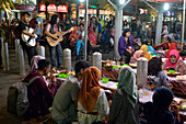 Open-air street side restaurant (lesehan) by night on Malioboro Street, major shopping street in Yogyakarta, Java island, Indonesia, Southeast Asia, Asia