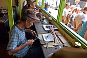 Workshop of copper plate stamps (cap) used to apply wax-resist to make pattern before dyeing in batik process, Sondakan district, Solo (Surakarta), Java island, Indonesia, Southeast Asia, Asia