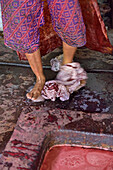 Feet fulling of cloth in the dyeing process, Kidang Mas Batik House, Lasem, Java island, Indonesia, Southeast Asia, Asia