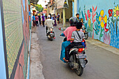 Street in Kauman Batik Village (Kampung), a district with many Batik producers and craftmen, Pekalongan, Java island, Indonesia, Southeast Asia, Asia