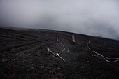 Hiking path in the ashes of Mount Fuji in a fog cloud, Honshu, Japan, Asia