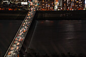 Traffic on bridges crossing the Yodo River and midnight night skyline of Osaka, Honshu, Japan, Asia