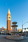 Water fountain and tower at The Venetian Las Vegas Hotel at sunset, Las Vegas Strip, Paradise, Las Vegas Boulevard, Las Vegas, Nevada, United States of America, North America