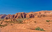 The Red Mountains rising behind the petrified sand dunes at Snow Canyon State Park, Southern Utah, United States of America, North America. Many famous films were made in the park which forms part of the Red Cliffs Desert Reserve.