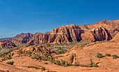 The Red Mountains rising behind the petrified sand dunes at Snow Canyon State Park, Southern Utah, United States of America, North America. Many famous films were made in the park which forms part of the Red Cliffs Desert Reserve.