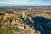 Craco ghost town abandoned by the population in the south of Italy, drone aerial view at sunset, Basilicata, Italy, Europe