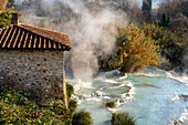 Saturnia hot springs with turquoise water and an old mill, Saturnia, Tuscany, Italy, Europe