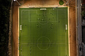 Aerial view of a training in a soccer field at night