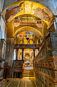 A beautiful side chapel with statues and golden mosaics in St. Mark's Basilica in Venice, Italy.