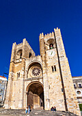 Lisbon, Portugal, March 1 2007, Visitors admire the stunning architecture of Lisbon's Cathedral, a key landmark showcasing Romanesque design in the heart of the city.