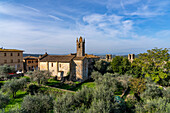 The Church of Santa Maria Assunta or Church of Saint Mary in the walled medieval town of Monteriggioni, Italy.