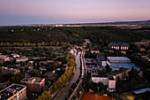 Aerial view of the Canal Imperial de Aragon in Zaragoza at sunset, Spain