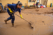 People cleaning. Effects of the DANA floods of October 29, 2024, Pelayo street, Paiporta, Comunidad de Valencia, Spain