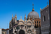 South facade of St. Mark's Basilica with the Doge's Palace at right, in Venice, Italy.