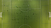 Aerial view of a training in a soccer field at night