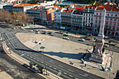 Explore the bustling Restauradores Square in Lisbon, Portugal, capturing the essence of urban life during daylight hours.