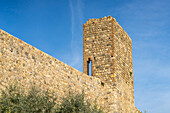 Watchtower on the city wall of the medieval walled town of Monteriggioni, Sienna, Tuscany, Italy. Viewed from outside.