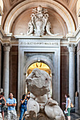 Rome, Italy, July 22 2017, Visitors admire the Belvedere Torso, an ancient sculpture in the Vatican Museums, highlighting its historical and artistic value.