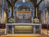 The high altar and tomb of St. Mark in the chancel of St. Mark's Basilica in Venice, Italy. The painted altarpiece is the reverse side of the Golden Altarpiece.