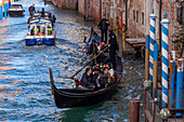 A pair of gondolas in a canal in Venice, Italy.