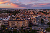 Aerial sunset view of a residential area of Zaragoza, next to the Ebro River