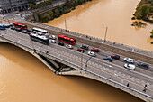 Aerial view of an abundant Ebro River passing under the Bridge after the Dana, Zaragoza, Spain