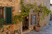 A small restaurant in the medieval walled town of Monteriggioni, Sienna Province, Italy.