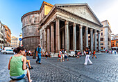 Rome, Italy, July 22 2017, Visitors stroll around the iconic Pantheon in Rome, enjoying the architecture and vibrant atmosphere on a warm day.