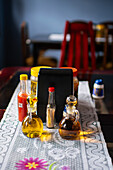 Restaurant table with olive oil and sauces, Costa Rica