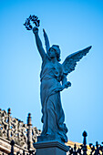 The Victoria Alada statue stands majestically in Plaza de America, located in the scenic Maria Luisa Park in Seville. This angelic figure holding a laurel represents peace and triumph.