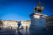 Lisbon, Portugal, March 1 2007, Young skaters practice their tricks in Figueira Square, enjoying the vibrant atmosphere of Lisbon's urban landscape.