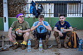 Volunteers resting after cleaning. Effects of the DANA floods of October 29, 2024, in Benetusser street, Paiporta, Comunidad de Valencia, Spain