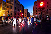 Rome, Italy, July 22 2017, Crowds of people walking at night in the vibrant city of Rome.