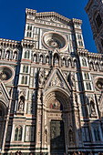 Detail of the ornate neo-Classical facade of the Duomo in Florence, Italy.