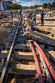 Effects of the DANA floods of October 29, 2024, train tracks in CV-406 road on bridge over Rambla del Poyo or barranco del Poyo, Paiporta, Comunidad de Valencia, Spain