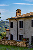 A hotel in a traditional building in the borga or medieval hilltop town of Farfa, Italy.