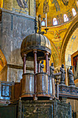 An carved stone ambo or pulpit in St. Mark's Basilica in Venice, Italy.