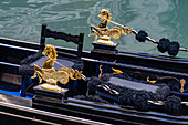 Detail of a gondola in Venice, Italy, showing brass seahorses.