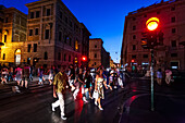 Rome, Italy, July 22 2017, Crowds of people walking at night in the vibrant city of Rome.