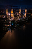 Aerial view of an illuminated El Pilar Basilica Cathedral and the Ebro River at night, Zaragoza, Spain