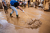 People cleaning. Effects of the DANA floods of October 29, 2024, Pelayo street, Paiporta, Comunidad de Valencia, Spain