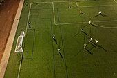 Aerial view of a training in a soccer field at night