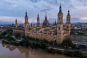 Aerial view of El Pilar Basilica Cathedral and the Ebro River at sunset, Zaragoza, Spain