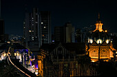 View of Plaza Botero and the famous metro system Medellin, Colombia. The metro includes street level trains and even aerial cable cars to connectthe city's downtown to the poorer neighborhoods in the surrounding mountains.