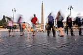 Rome, Italy, July 22 2017, Visitors wander through Piazza del Popolo, enjoying the lively atmosphere and historical architecture as sunset approaches.