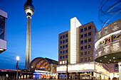 Berlin, Germany, July 29 2009, Alexanderplatz buzzes with activity at night, featuring the iconic Fernsehturm and modern architecture, illuminating Berlin\'s skyline.