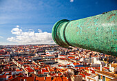 Enjoy a panoramic view of Lisbon, showcasing colorful rooftops and the iconic fortress at the top of Saint George Castle.