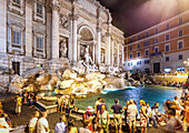 Rome, Italy, July 2017, Visitors fill the Trevi Fountain area, enjoying the magical ambiance of Rome at night.