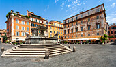 Visitors enjoy the charming atmosphere of Santa Maria in Trastevere square, surrounded by historic architecture and lively cafés.